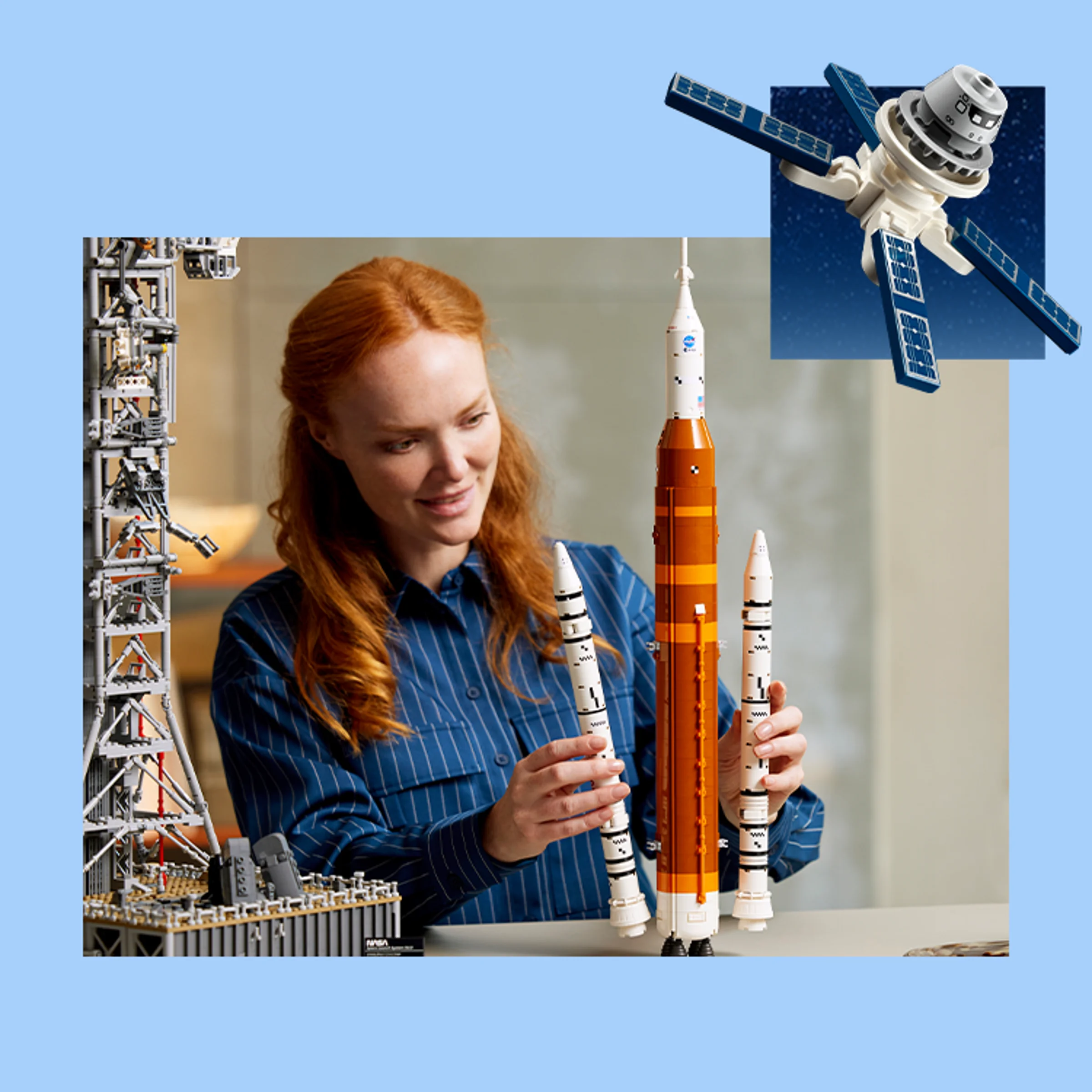 Femeie aranjând rachetele LEGO din setul 10360. Lansatorul și satelitul sunt și ei vizibile.