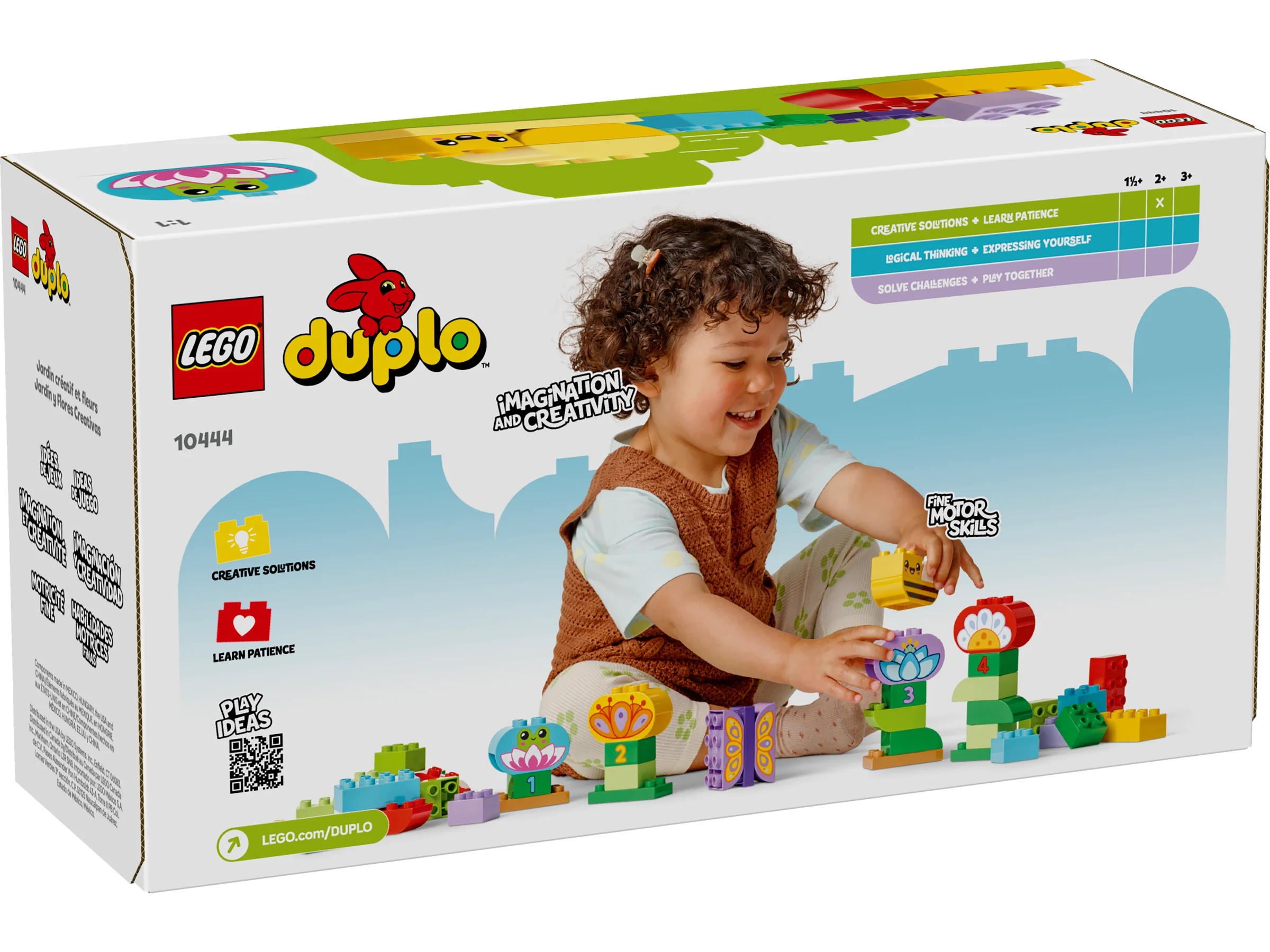 Imagine cu cutia setului LEGO Duplo 10444, cu o fetiță construind flori colorate.