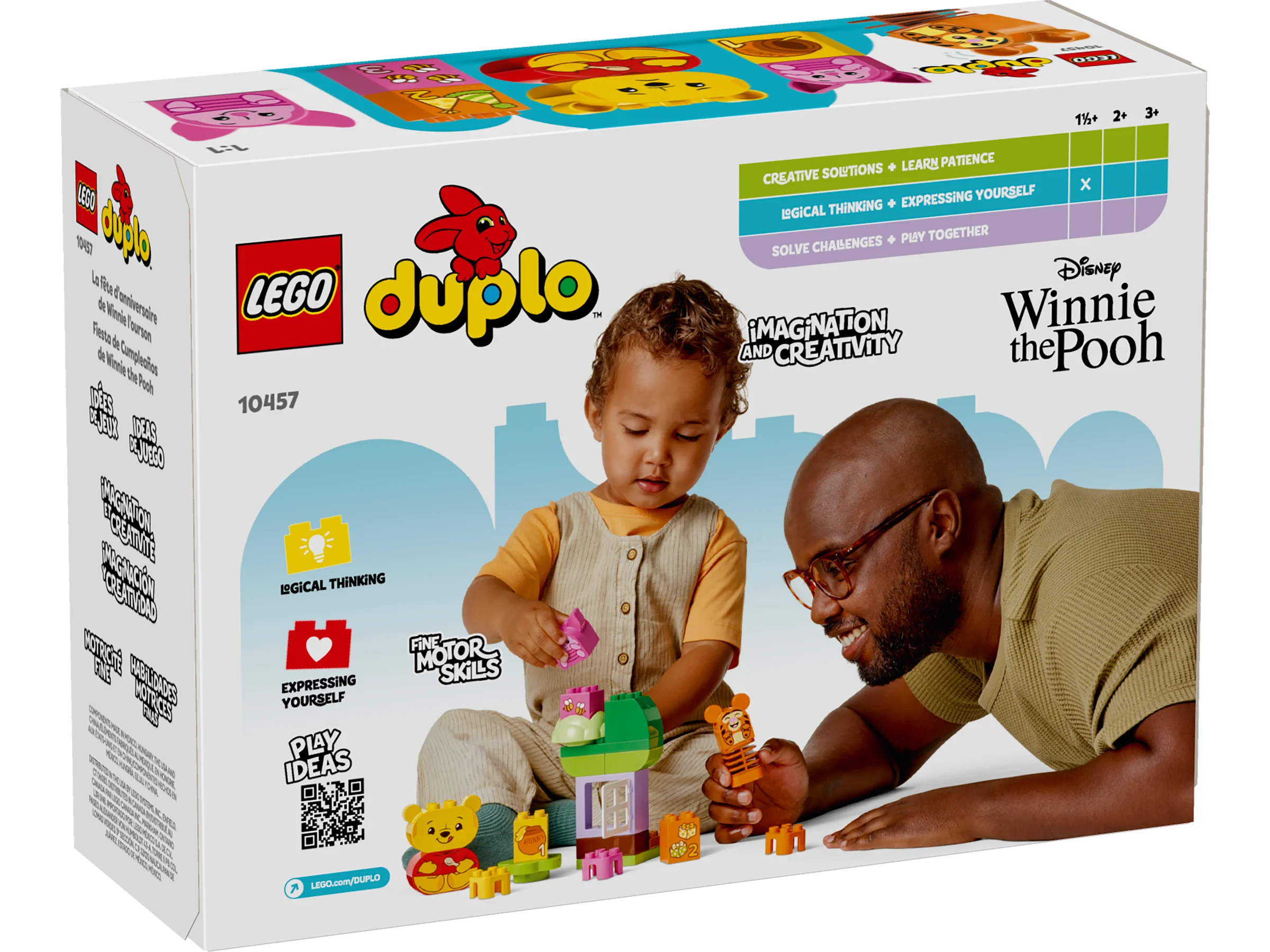 Cutie LEGO Duplo 10457, „Petrecerea de ziua lui Winnie the Pooh”, arătând un tată și copil jucându-se.