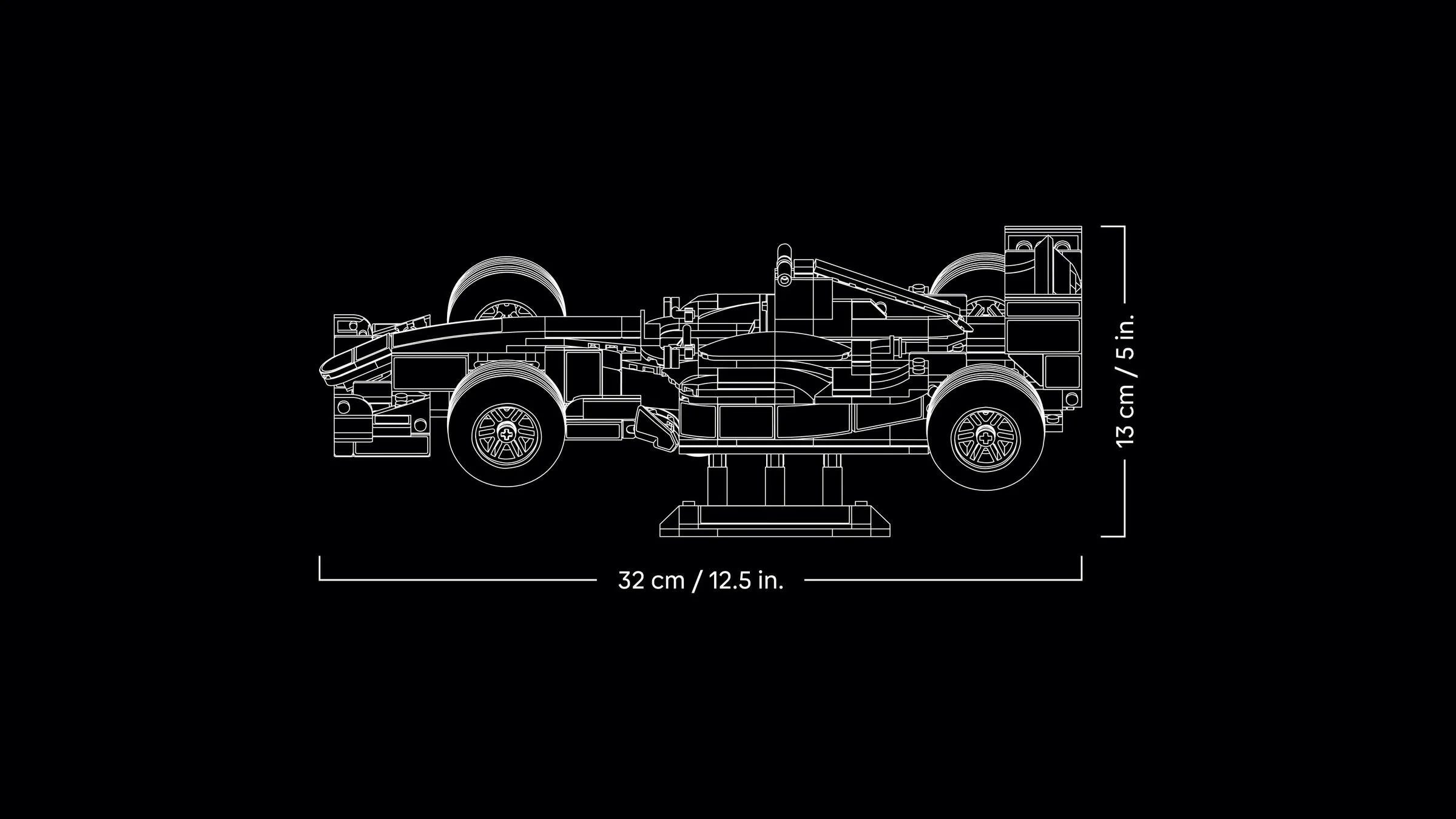 Diagramă a modelului Ferrari F2004 cu dimensiuni: 32 cm lungime și 13 cm înălțime.