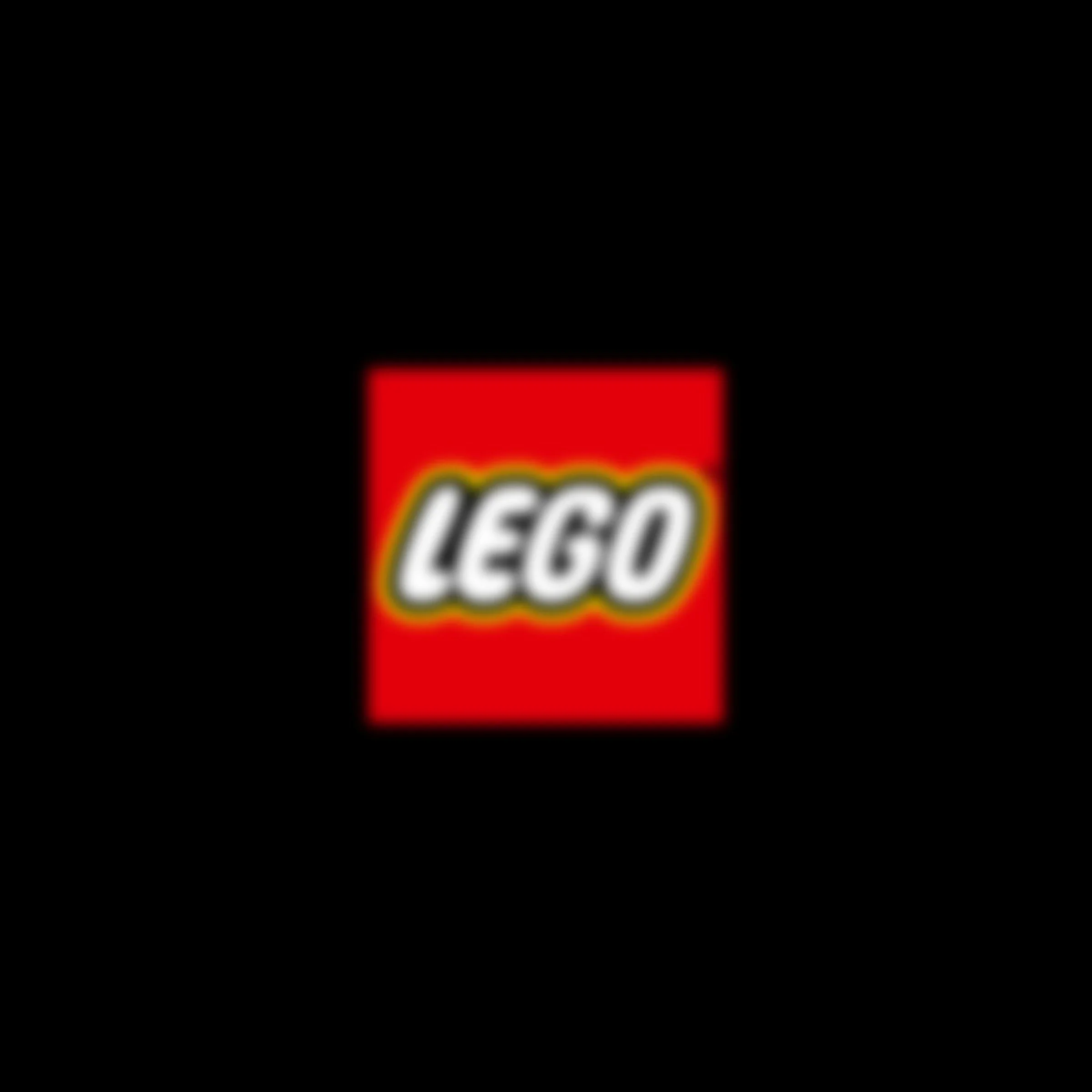 Logo-ul LEGO, roșu și estompat, pe un fundal negru.