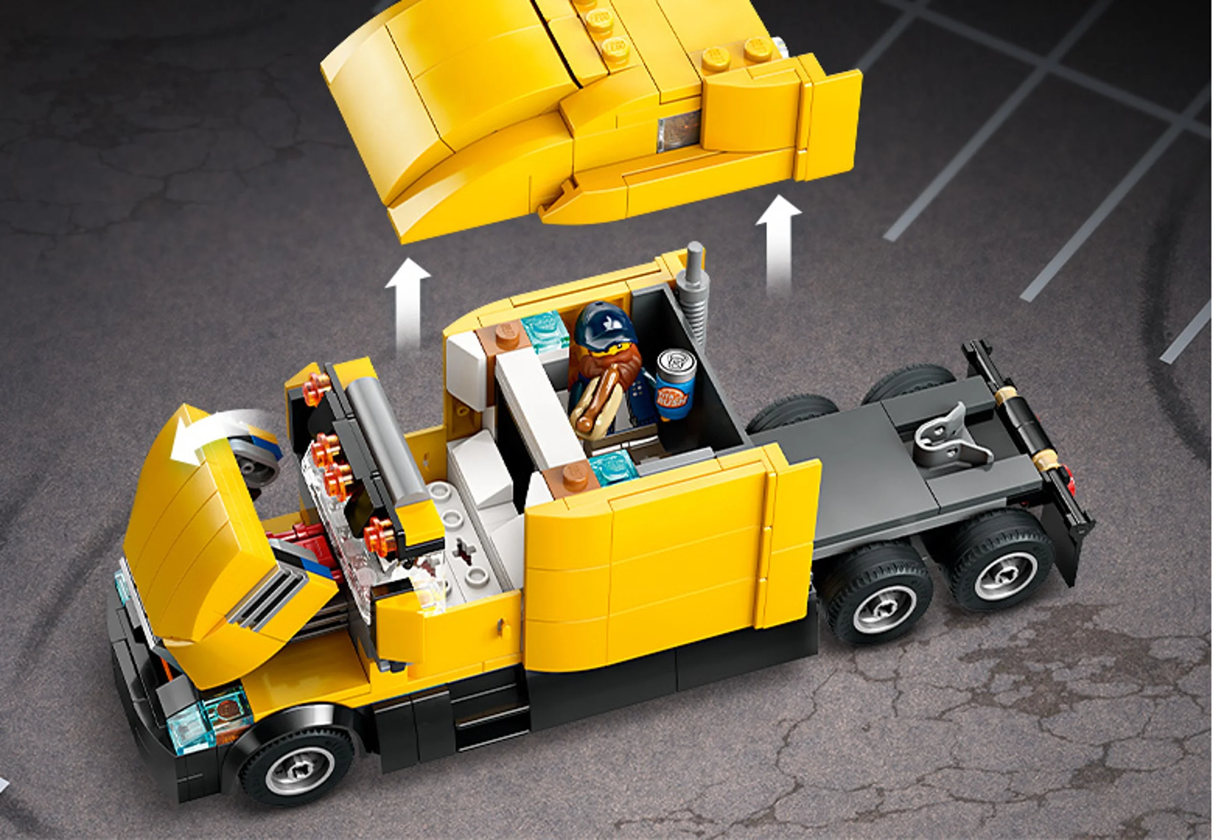 Camionul LEGO galben cu cabină detașabilă și minifigurină șofer cu hotdog.