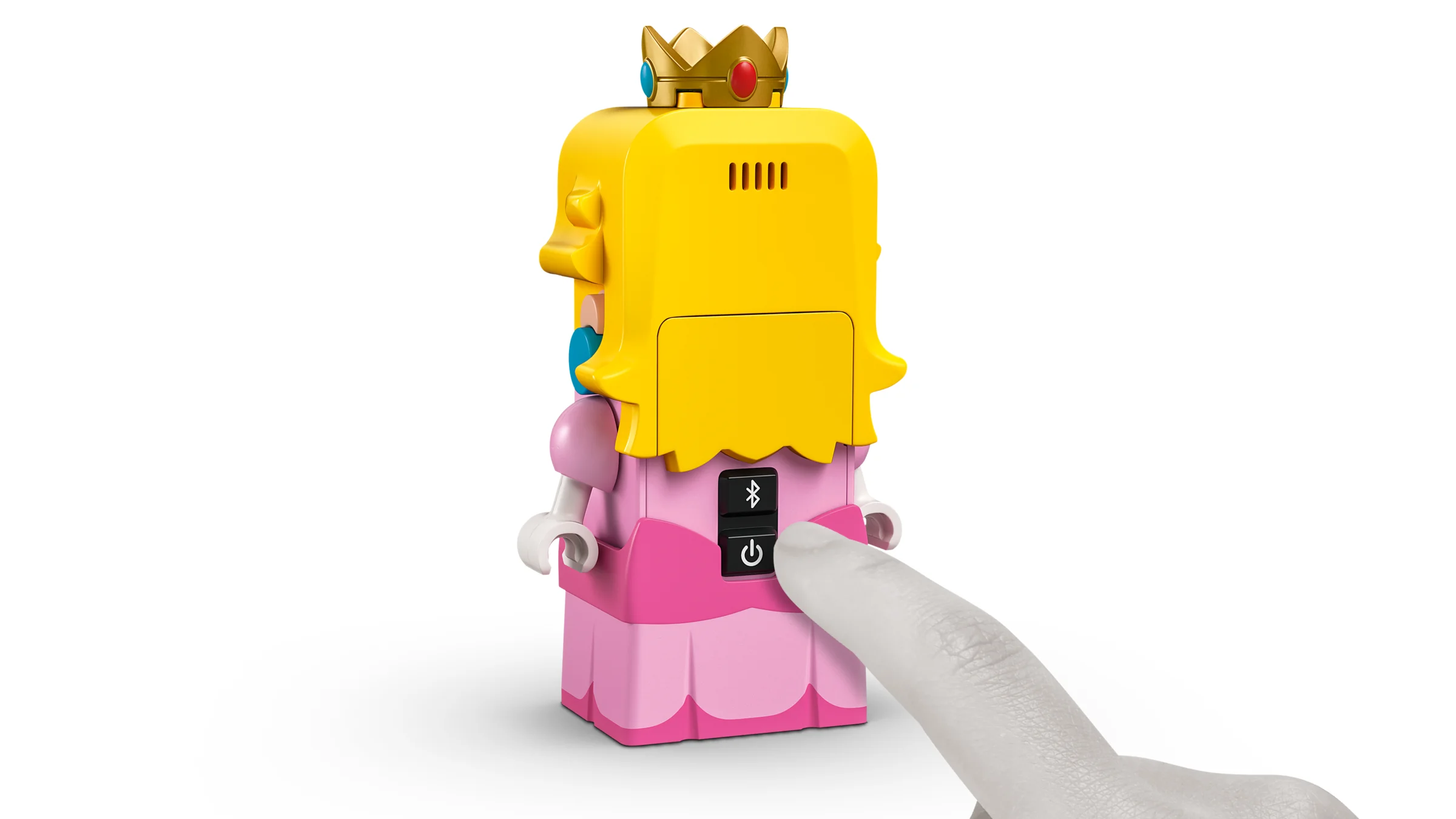 Interacțiune cu LEGO Peach: deget apasă butonul de pornire. Funcții și design atrăgător.