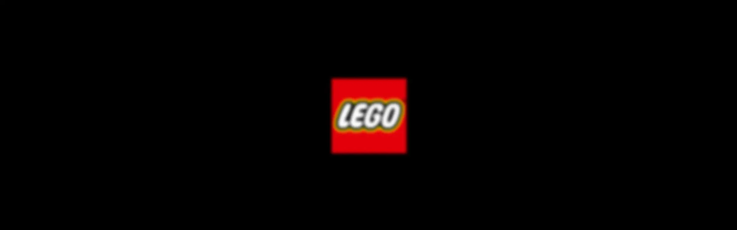 Logo-ul LEGO roșu pe un fundal negru. 