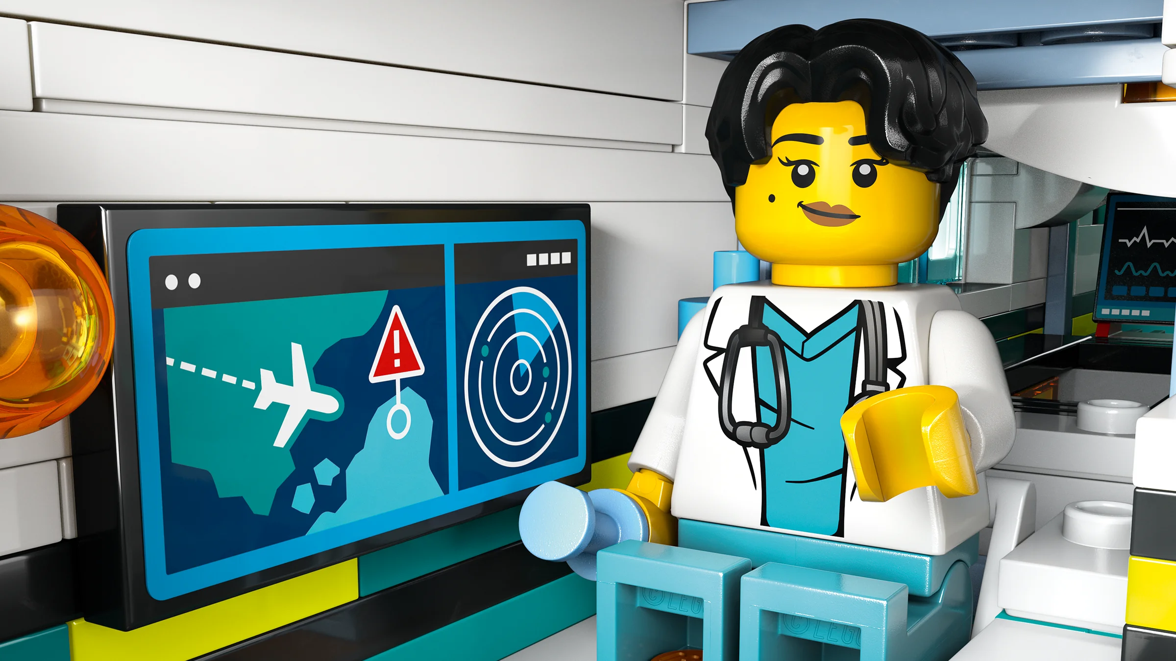 Prim-plan cu minifigurina doctoriță și monitorul din ambulanța aeriană.
