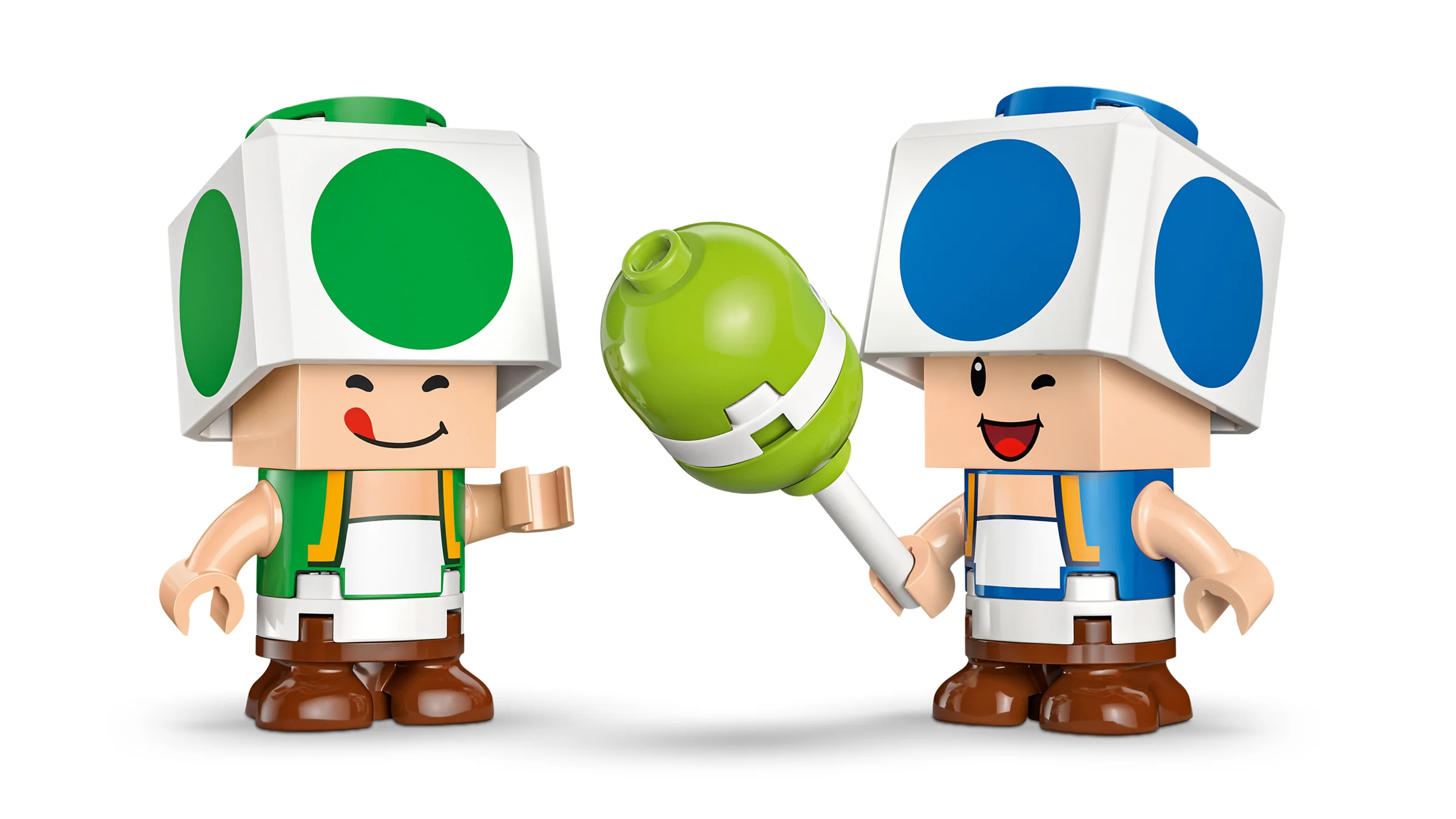 Doi mini-figurine Toad, unul verde și unul albastru, cu o ciupercă verde.