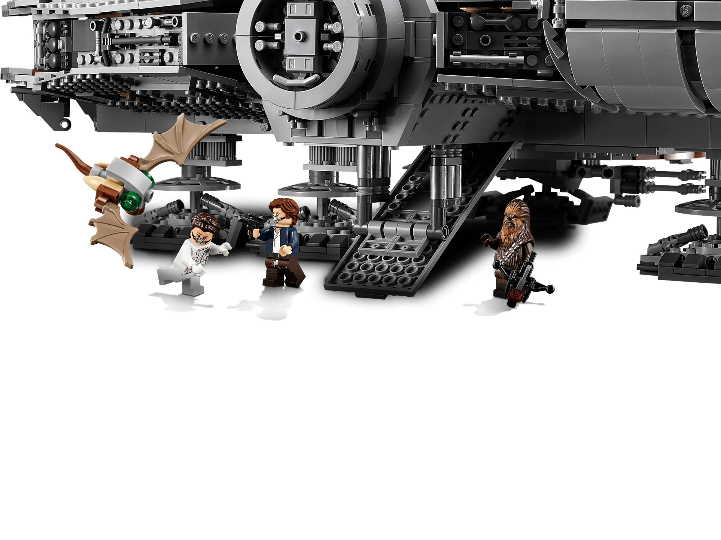 Mini-figurine Han Solo, Chewbacca, Leia și un Mynock lângă nava Millennium Falcon.