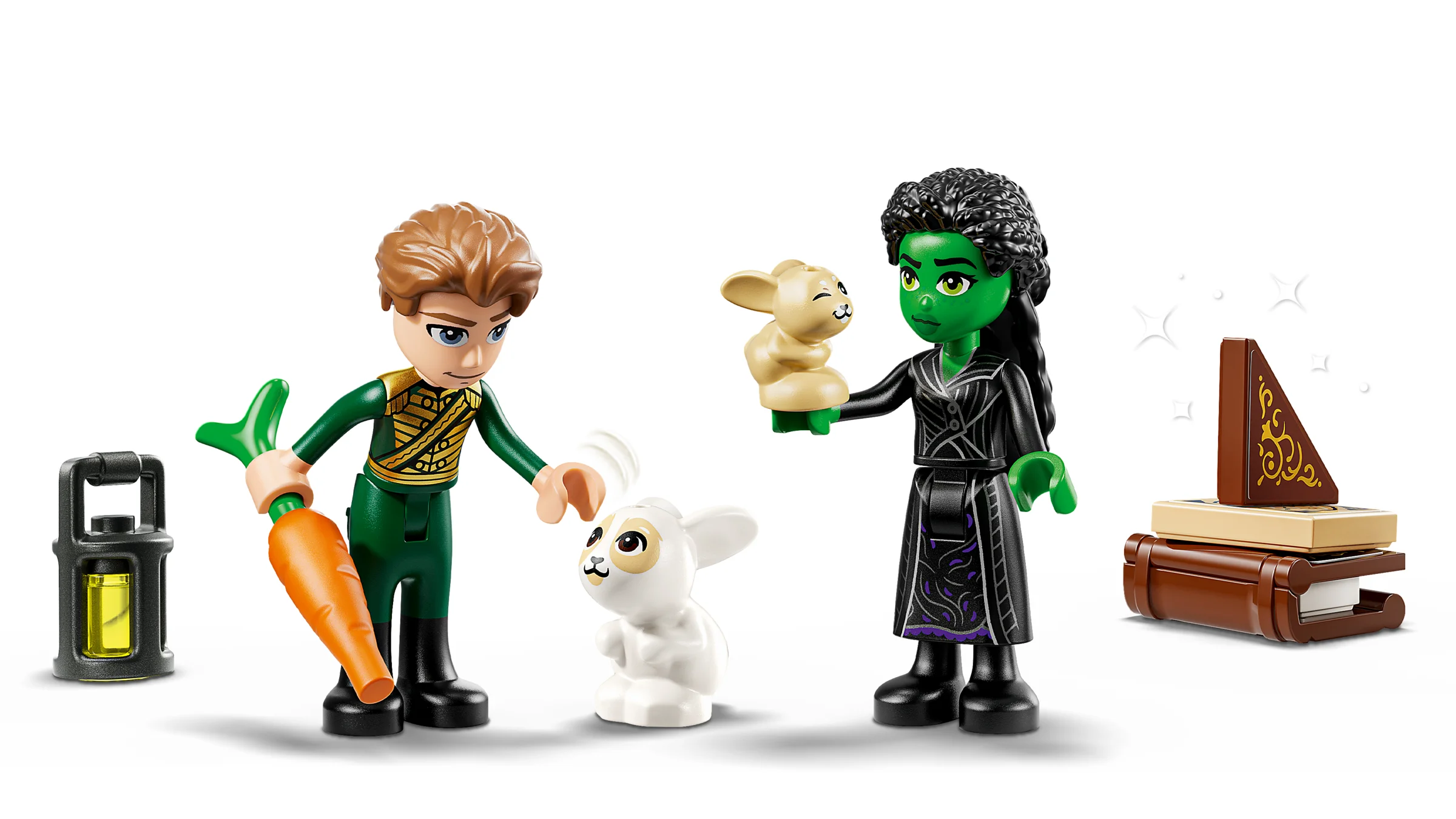 Imagine cu minifigurinele Elphaba, Oz și accesorii: iepuri, morcov, carte cu magie și lanternă.