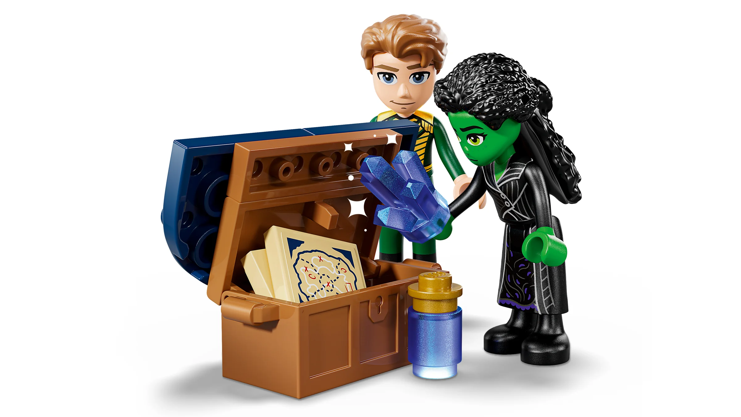 Minifigurinele Elphaba și prietenul ei lângă cufărul cu cristale și hartă.