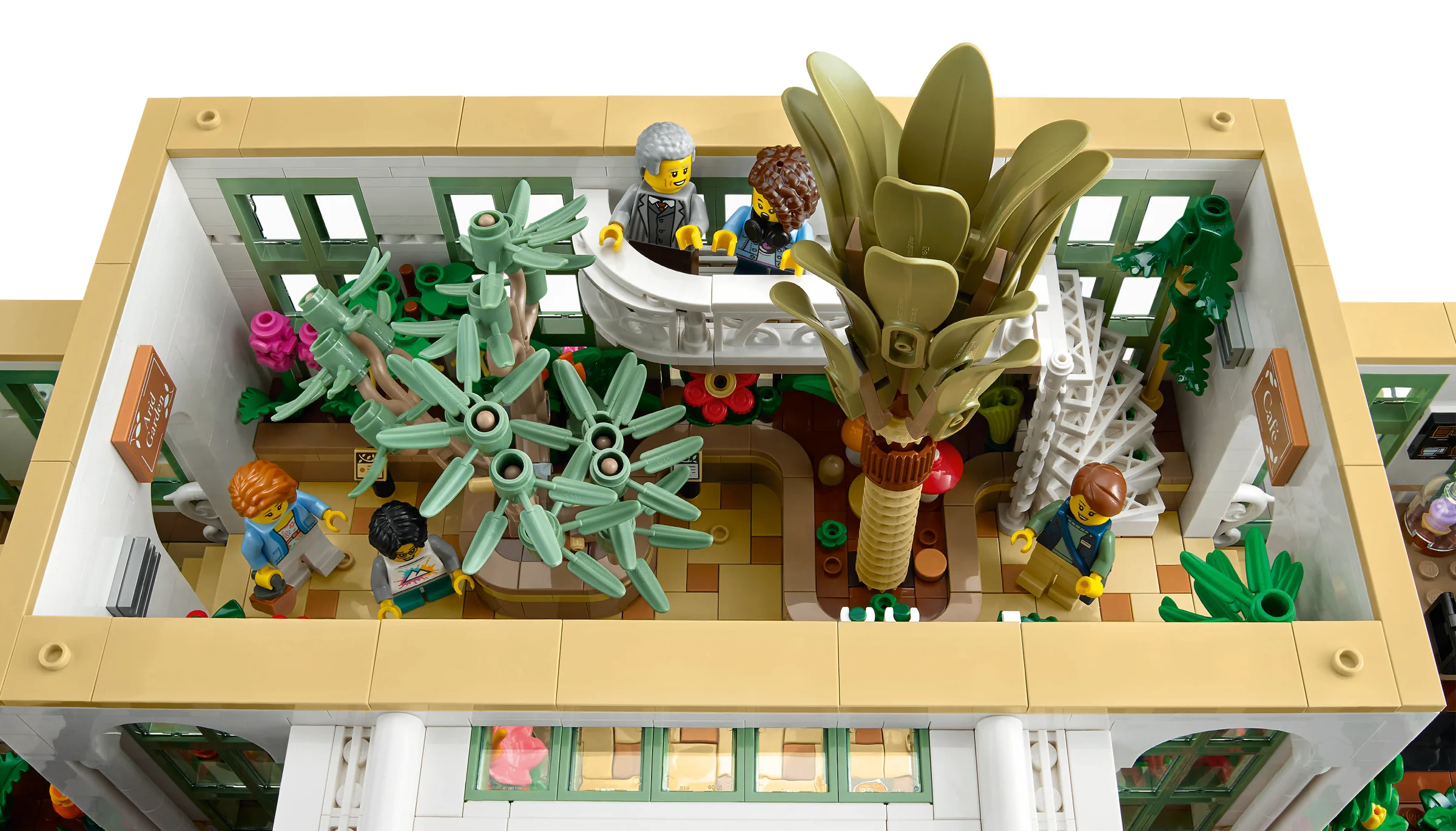 O vedere de sus a Grădinii Botanice LEGO, cu plante și minifigurine.
