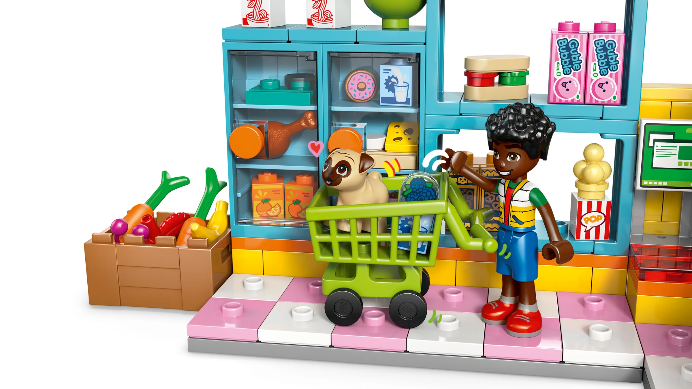 Imagine cu un personaj și un cărucior de cumpărături într-un mini supermarket LEGO Friends.