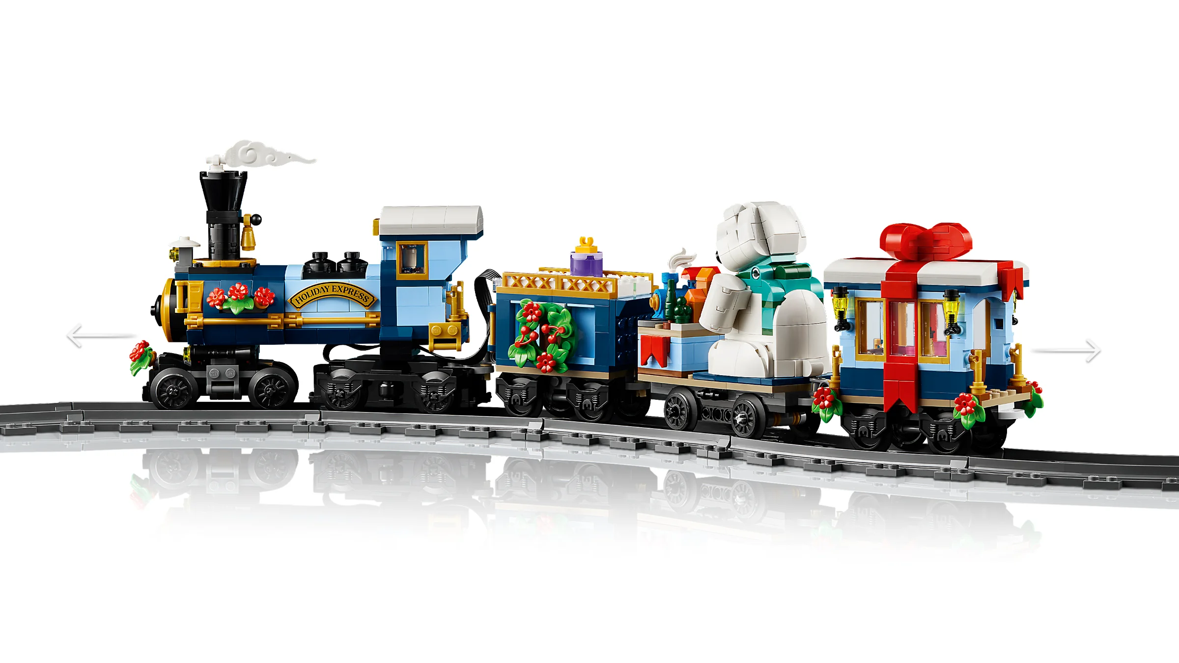Imagine cu trenul Holiday Express, model detaliat LEGO cu locomotive și vagoane festive.