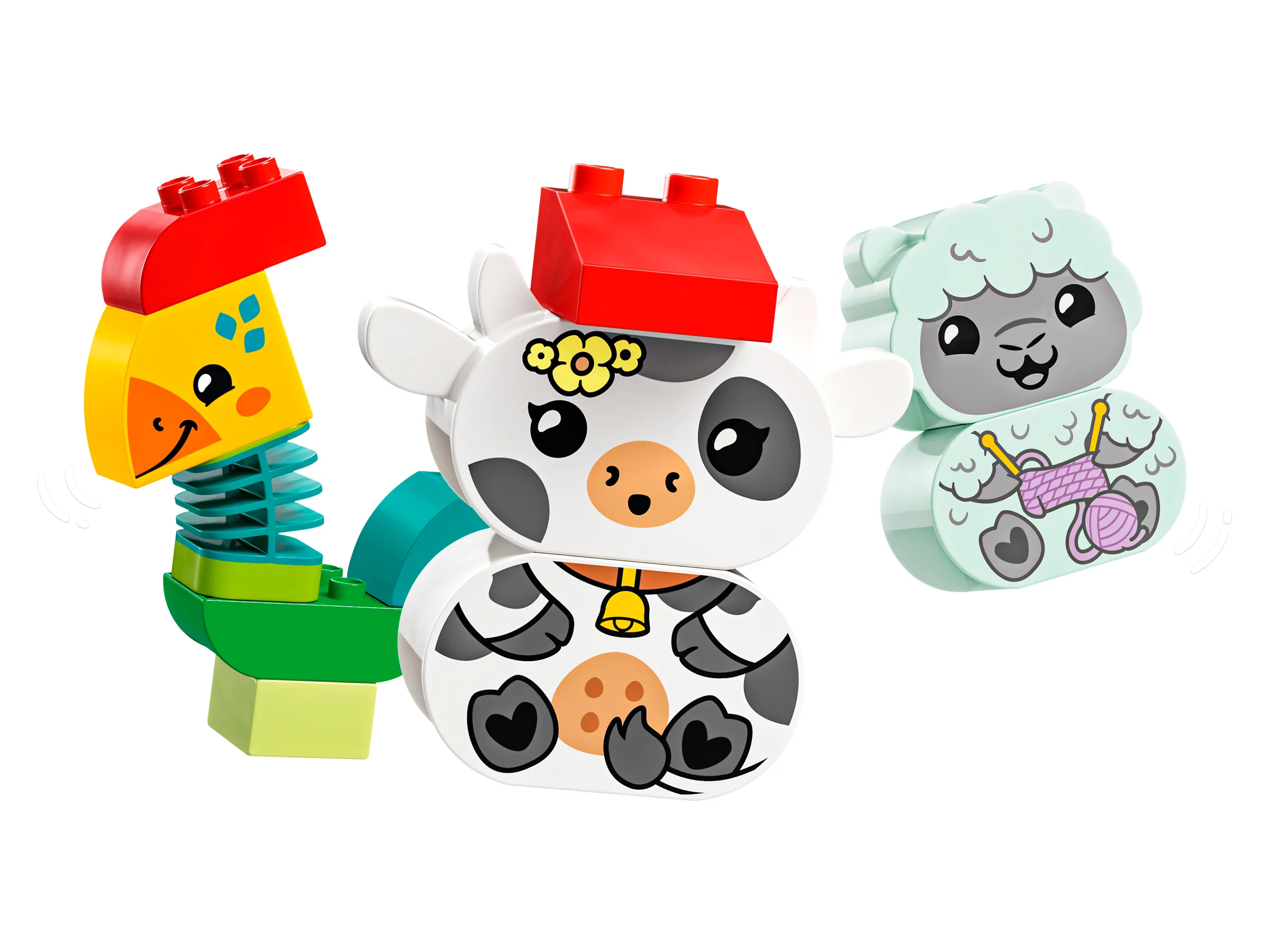 Imagine cu o girafă, o vacă și o oaie Duplo, jucării pentru copii mici.
