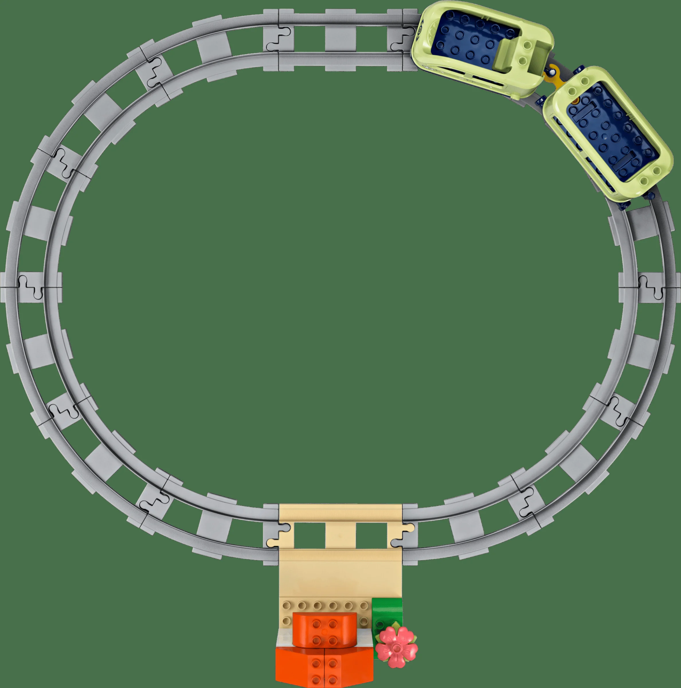 Imagine cu șinele de tren Duplo formând un circuit oval, și vagoane atașate.
