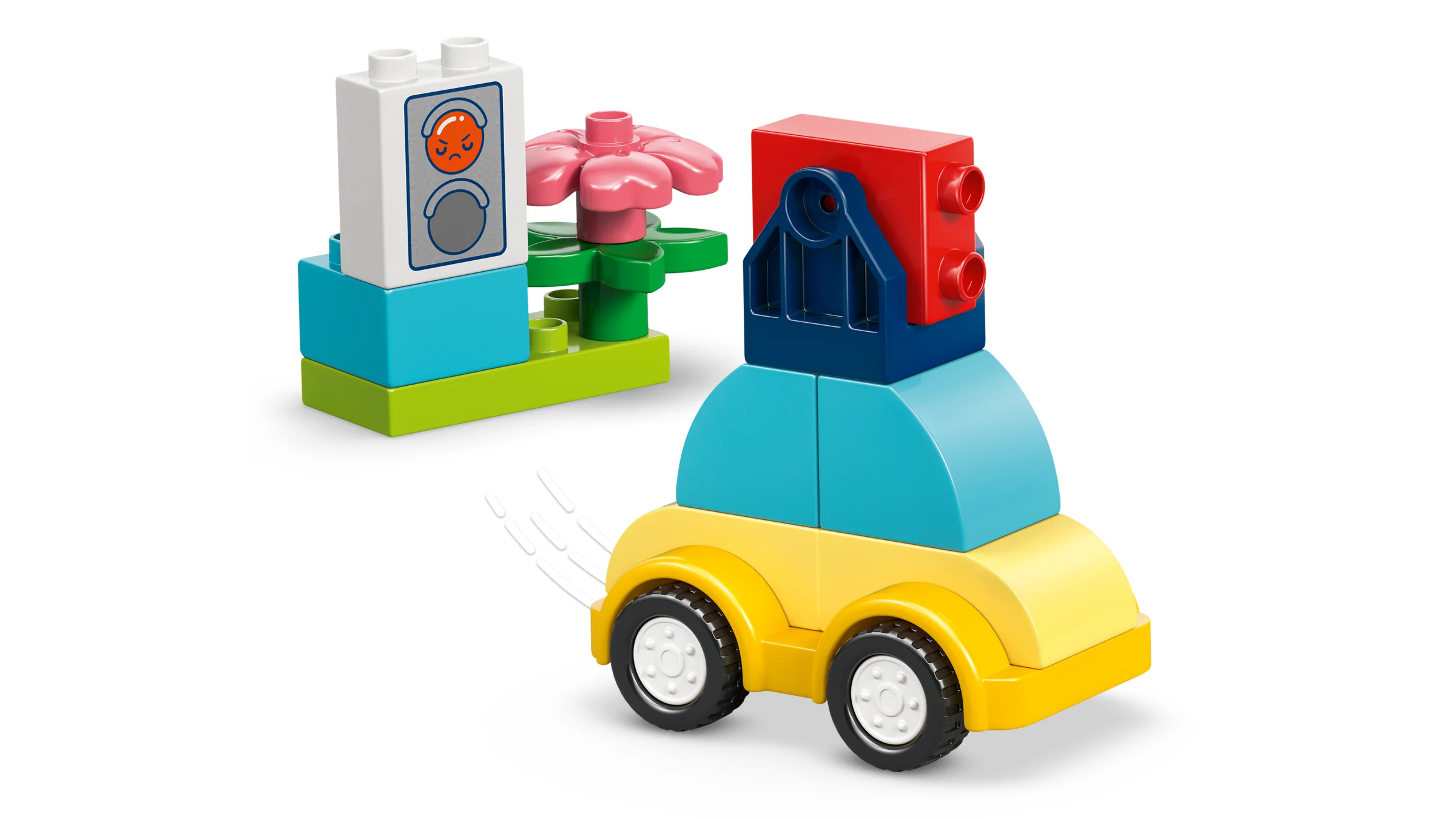 Imagine cu o mașină și o construcție suplimentară din setul LEGO® DUPLO® Vehicule Creative.