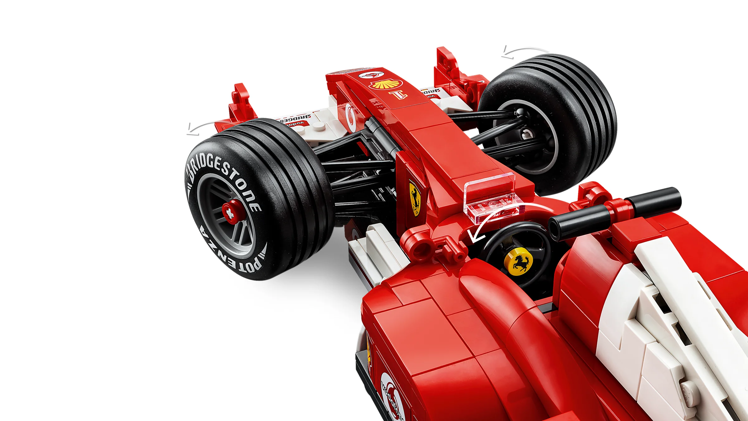 Prim-plan detaliat al monopostului Ferrari F2004, accent pe pneuri și elemente aerodinamice.