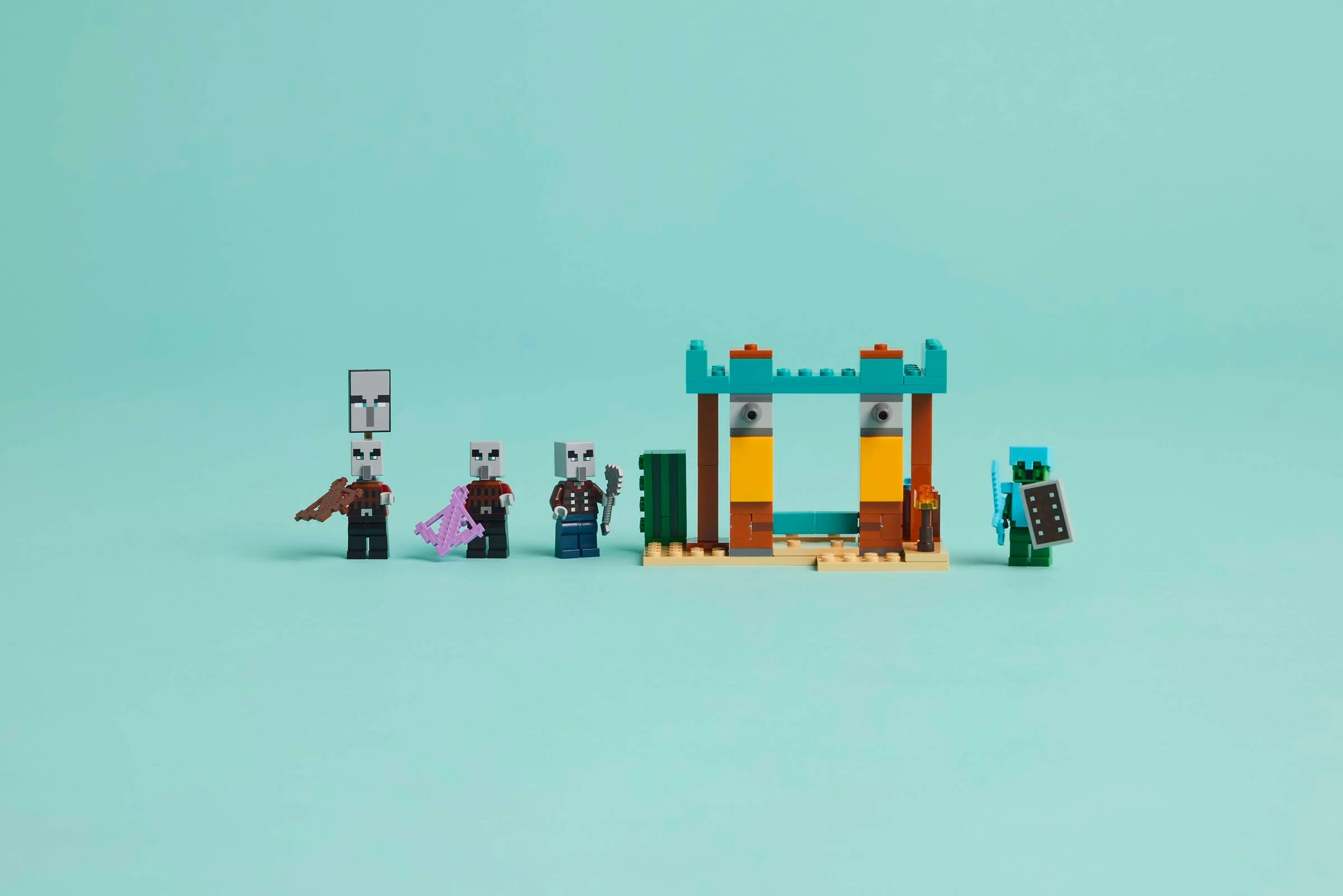 Imagine cu setul LEGO Minecraft 21267, cu mini-figurine și o structură de deșert.