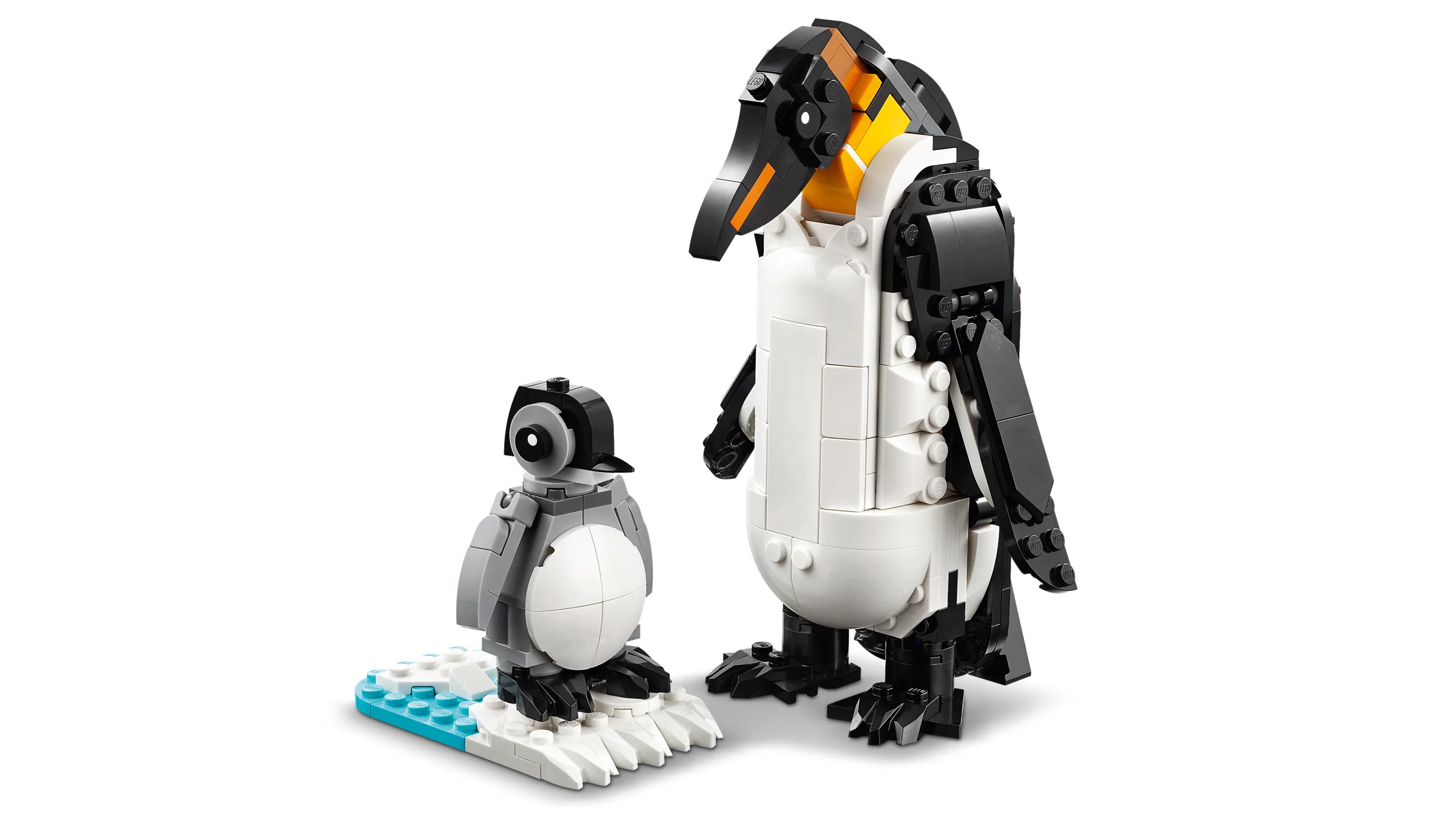 Imagine cu pinguinii construiți din LEGO, un adult și un pui.