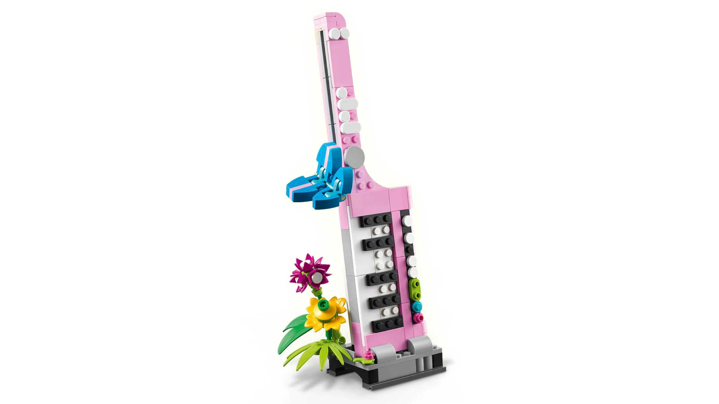 Imagine cu detaliile mașinii de scris roz LEGO și florile din setul 31169.
