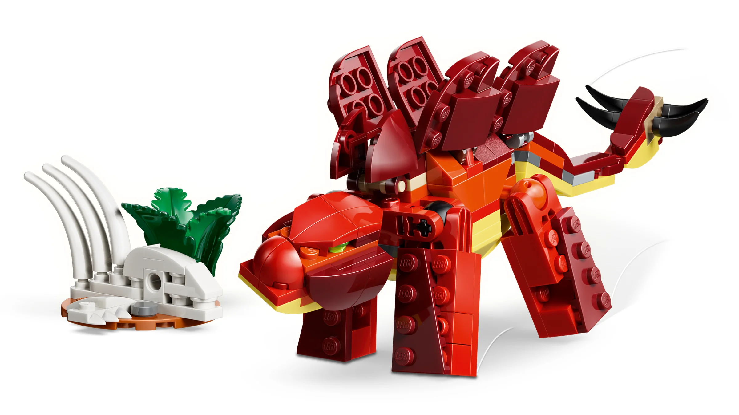 Dinozaurul LEGO Creator 31379, roșu și portocaliu, alături de oase și frunze verzi.