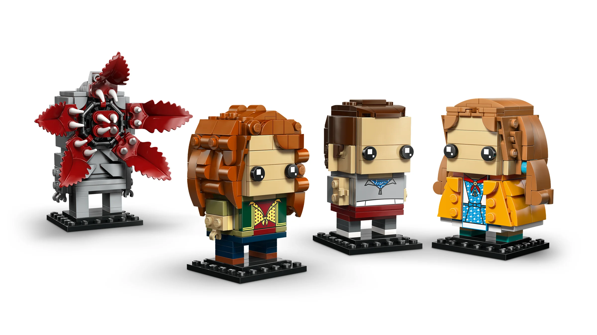 Imagine cu figurinele construibile Eleven, Max, Demogorgon și Holly BrickHeadz.