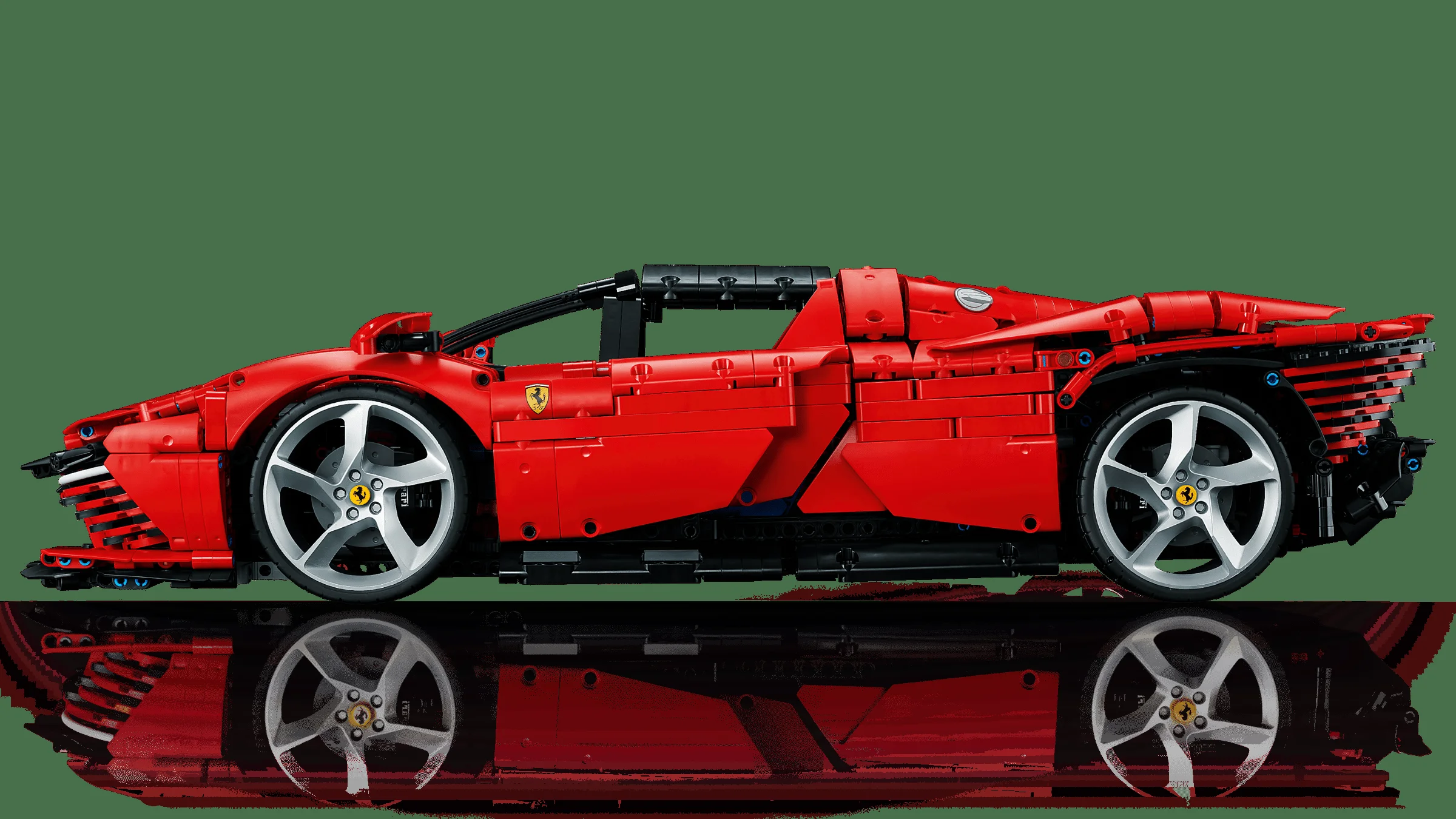 O vedere laterală a modelului Ferrari Daytona SP3, roșu, cu reflexie pe suprafață. Model detaliat.