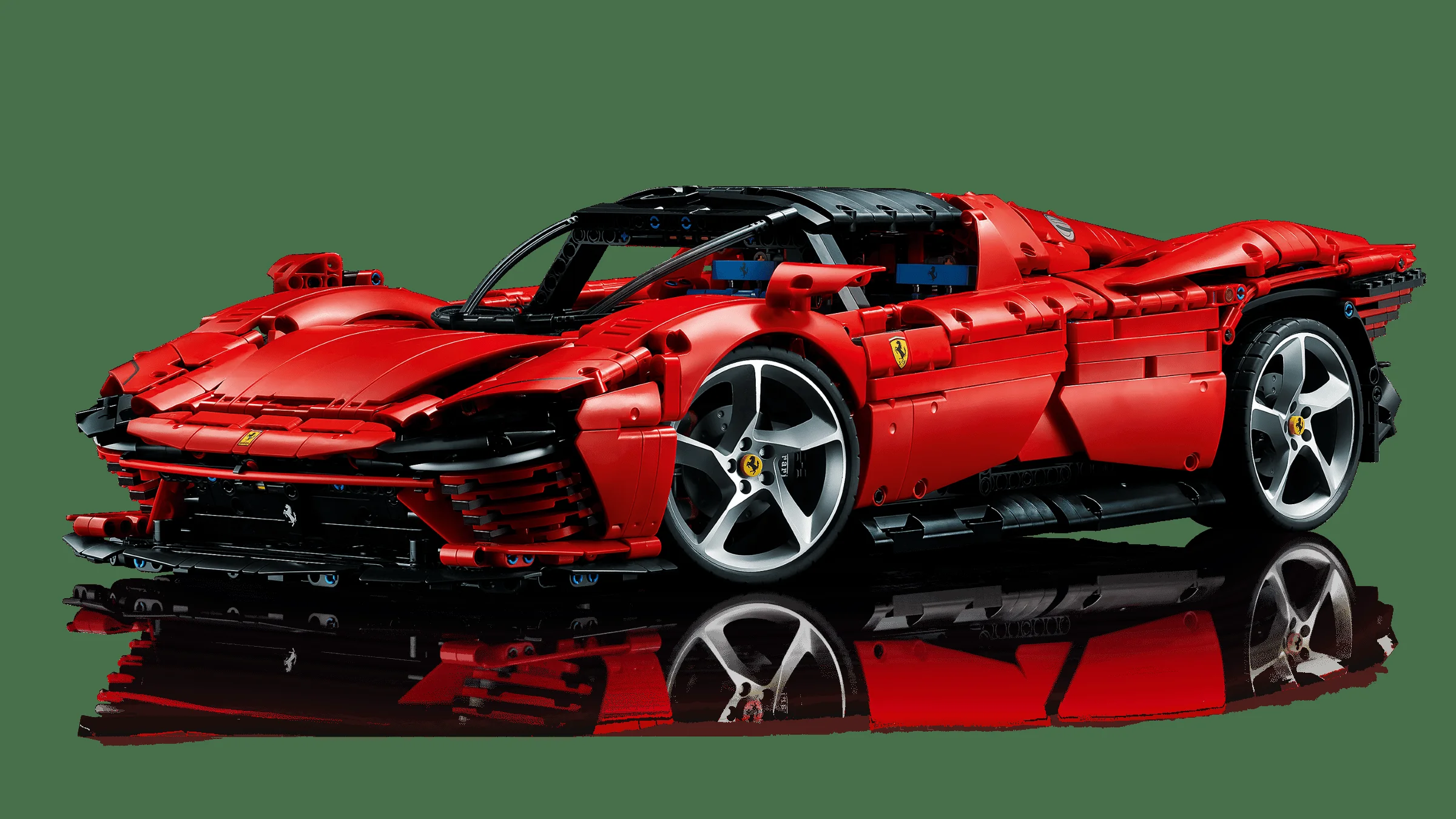 Modelul Ferrari Daytona SP3, roșu intens, cu reflexie pe o suprafață lucioasă, elegant și detaliat.