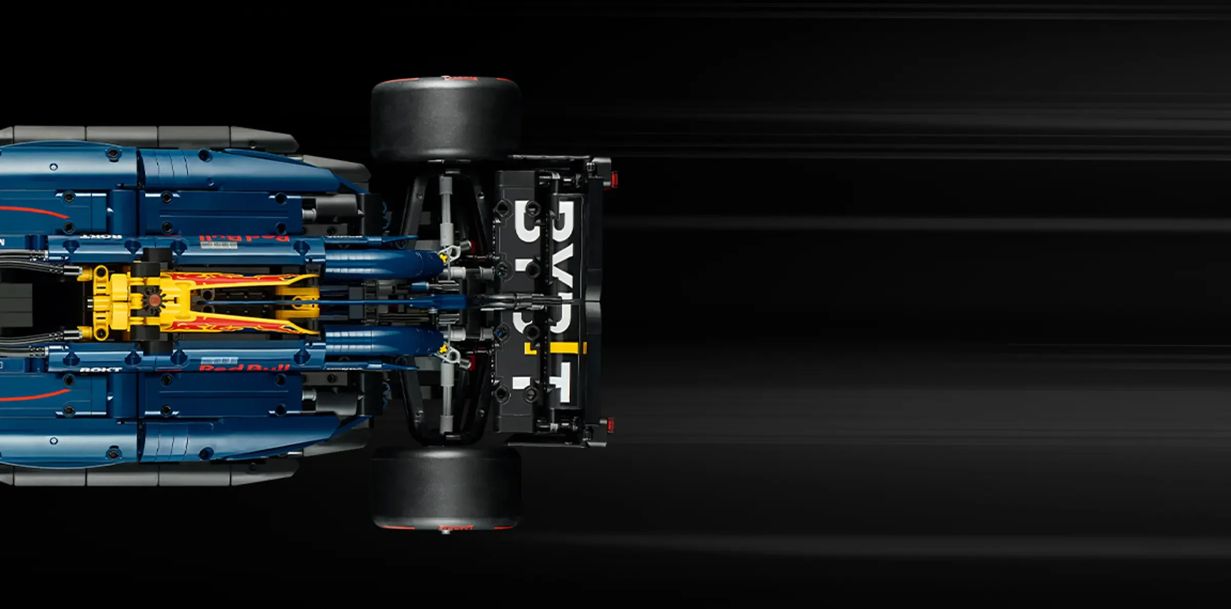 Imagine de sus a mașinii LEGO Technic Red Bull Racing RB20, albastră și galbenă.
