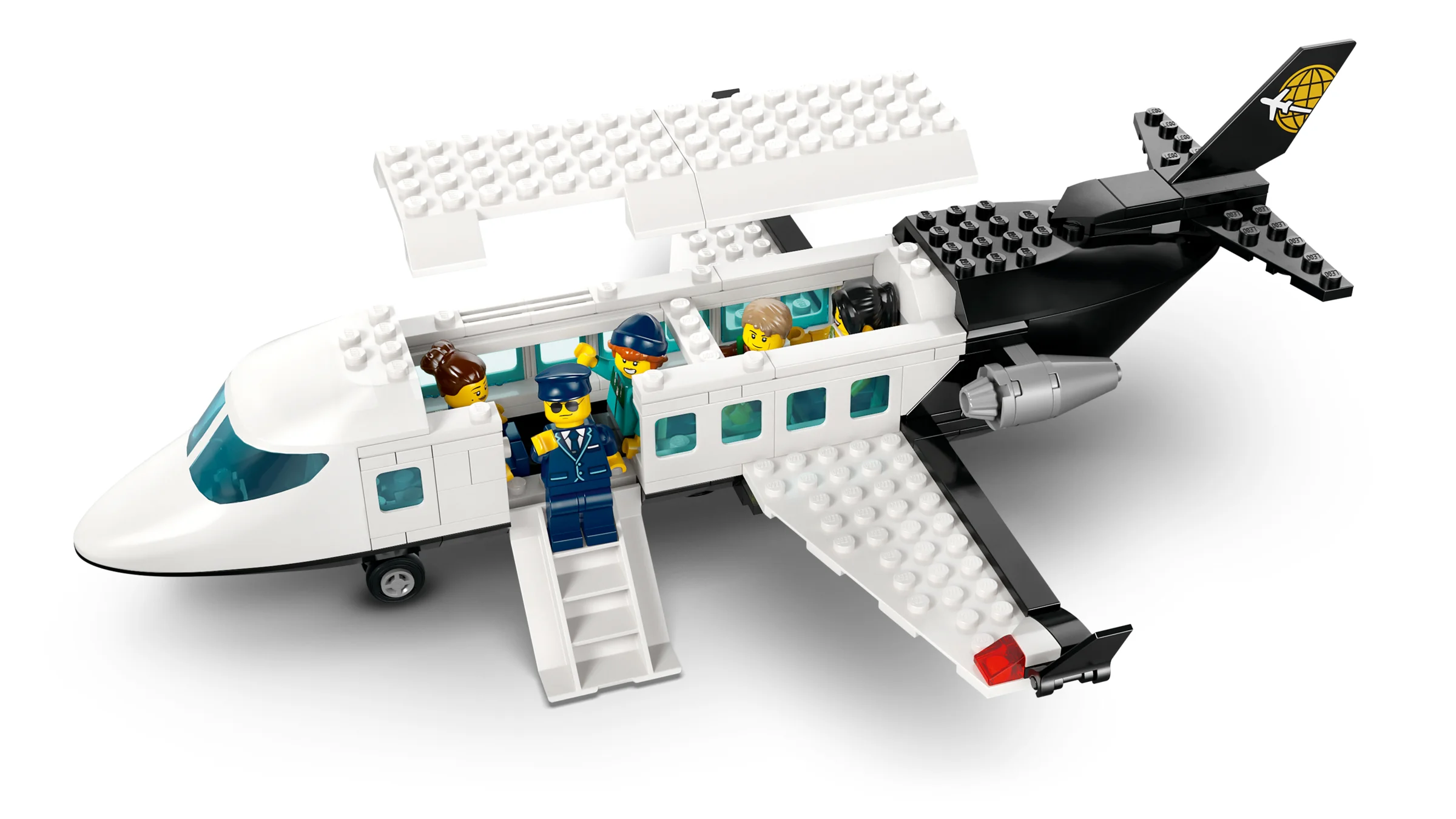 Avion alb cu negru, cu minifigurine la bord. Arată detaliile aeronavei.