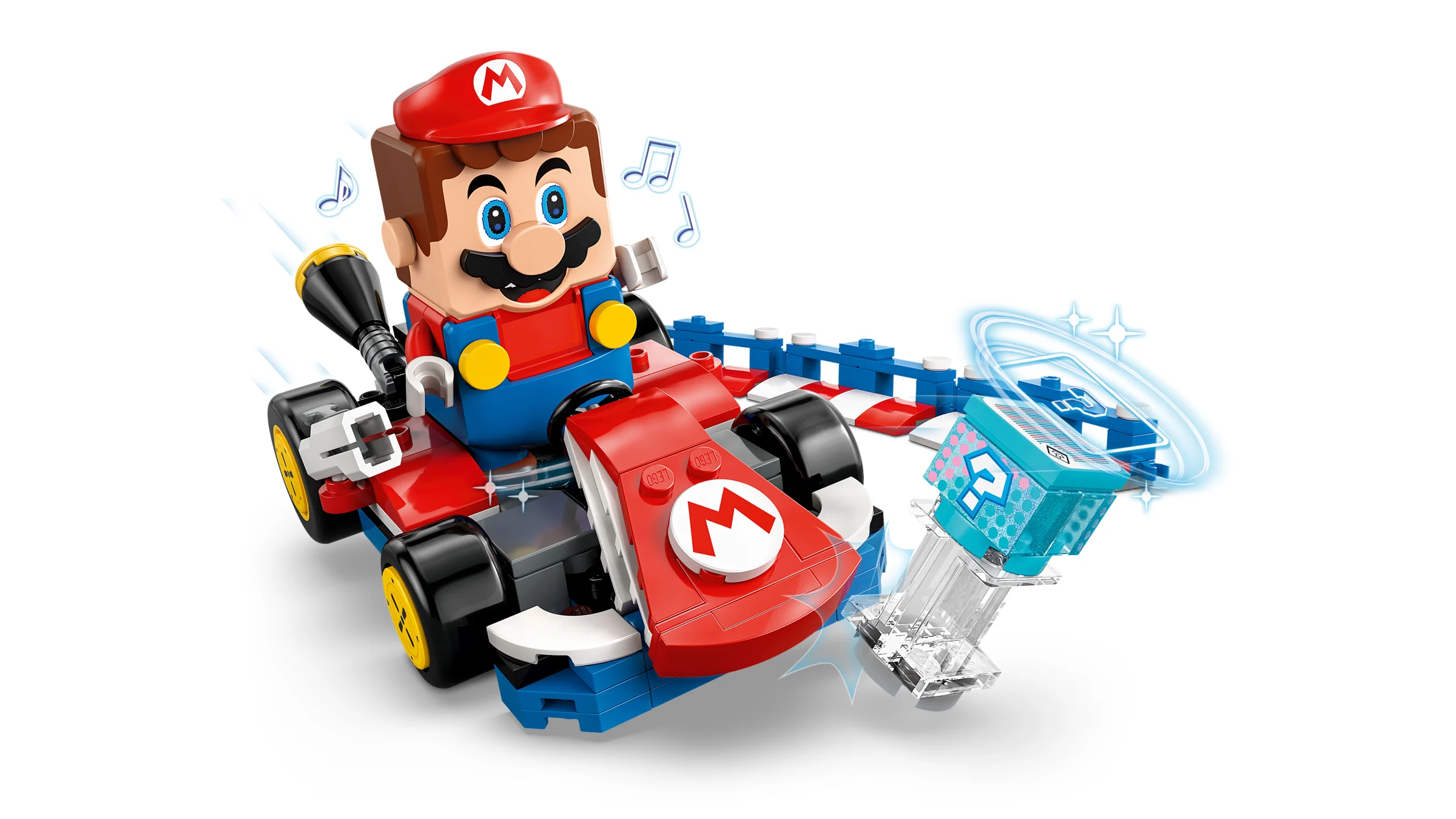 Imagine cu Mario LEGO interactiv într-un kart, plus o cutie cu semnul întrebării.