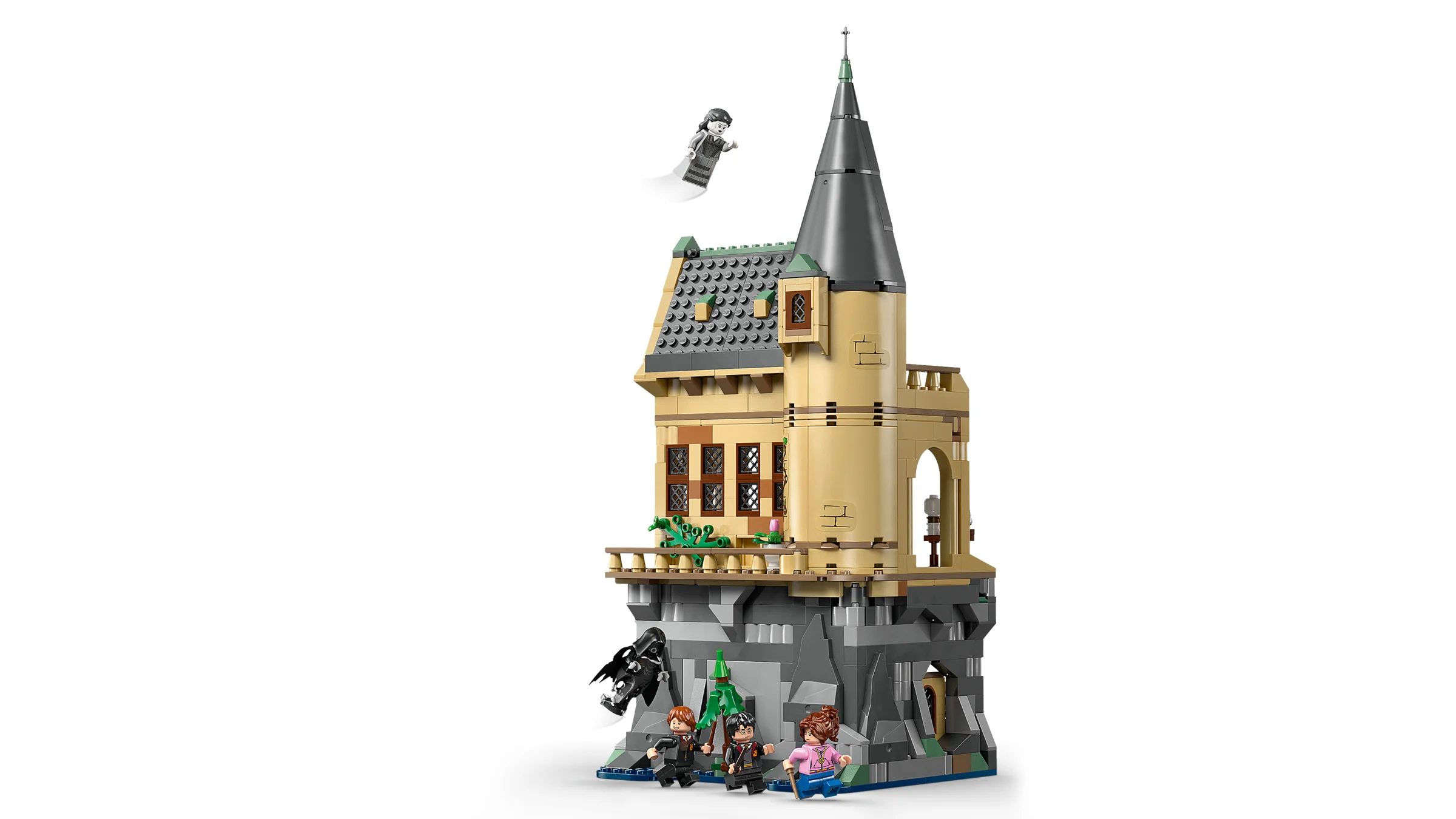 Imagine cu Castelul Hogwarts și aripa spitalului, cu minifigurinele Harry, Ron și Hermione.