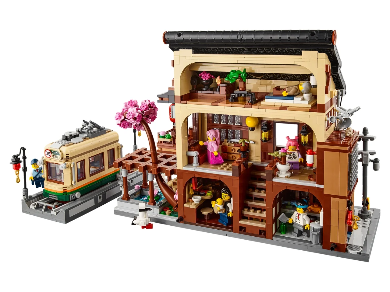 Imagine detaliată cu restaurantul de sushi LEGO 910060 și tramvaiul, vedere din lateral, arătând interiorul.