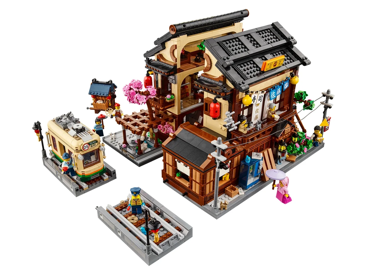 Imagine cu setul LEGO 910060 Restaurantul Sushi, care prezintă clădirea, tramvaiul și minifigurinele.