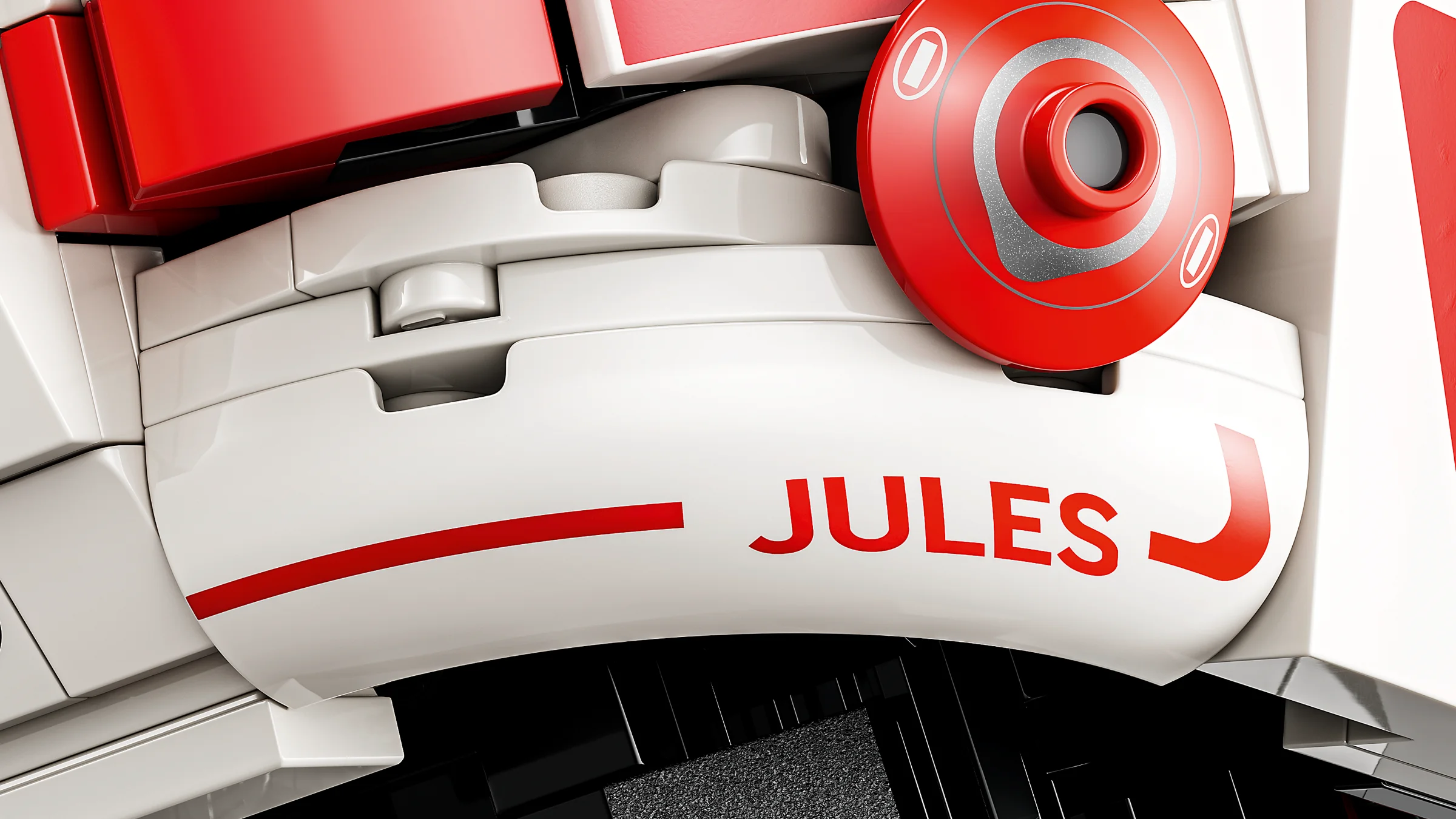 Detaliu al căștii Ferrari, inscripția JULES, roșu și alb, finisaje realiste.
