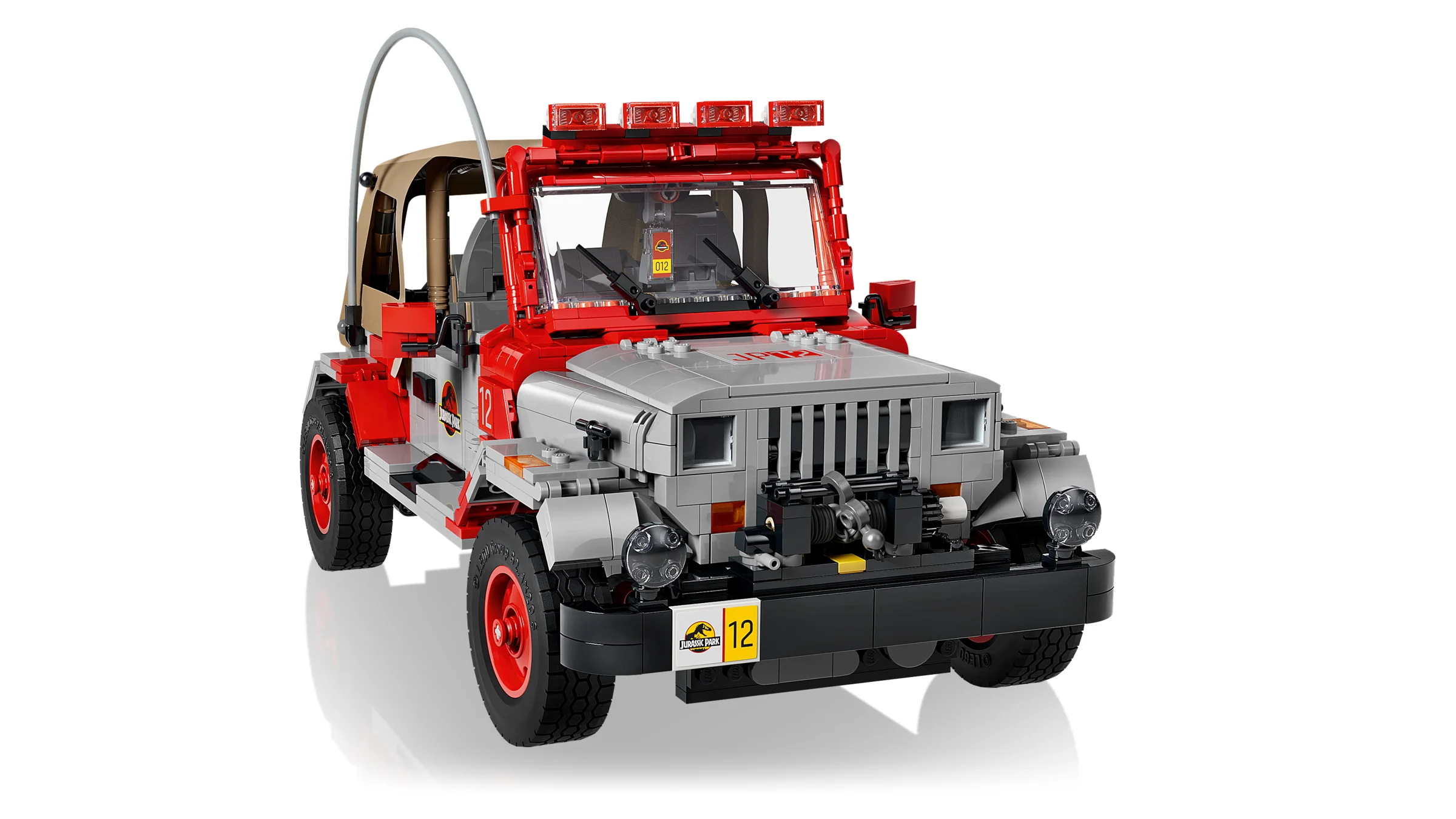 Jeep Wrangler Jurassic Park roșu și gri, cu detalii autentice. O imagine detaliată a modelului.