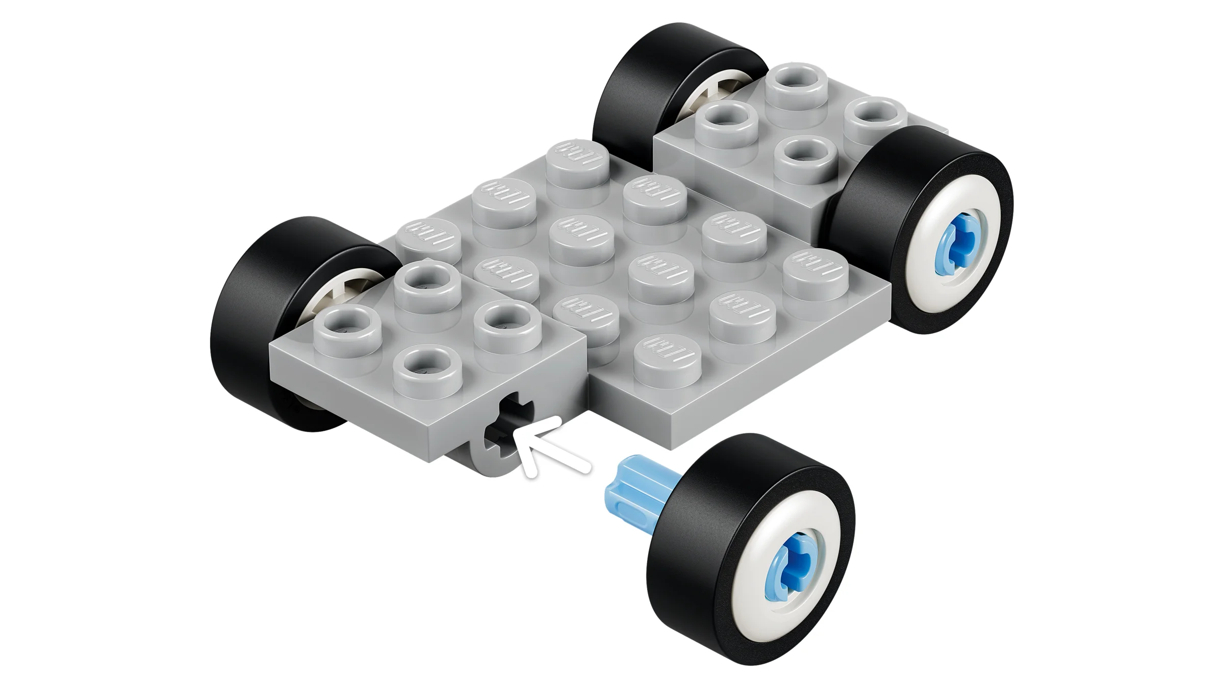 Construcția unei mașinuțe LEGO, arătând atașarea roților. Pas important din instrucțiuni.