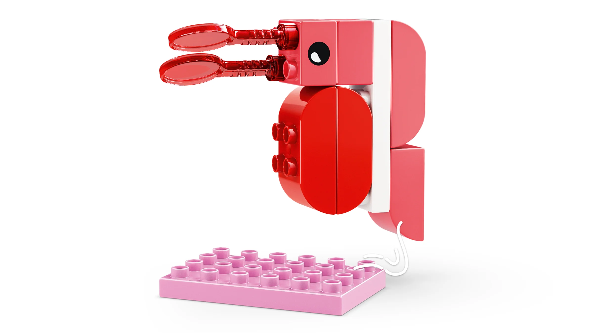 Imagine cu un crab LEGO DUPLO roșu și roz, parte din setul 10472. Detaliile sunt clare și atractive.