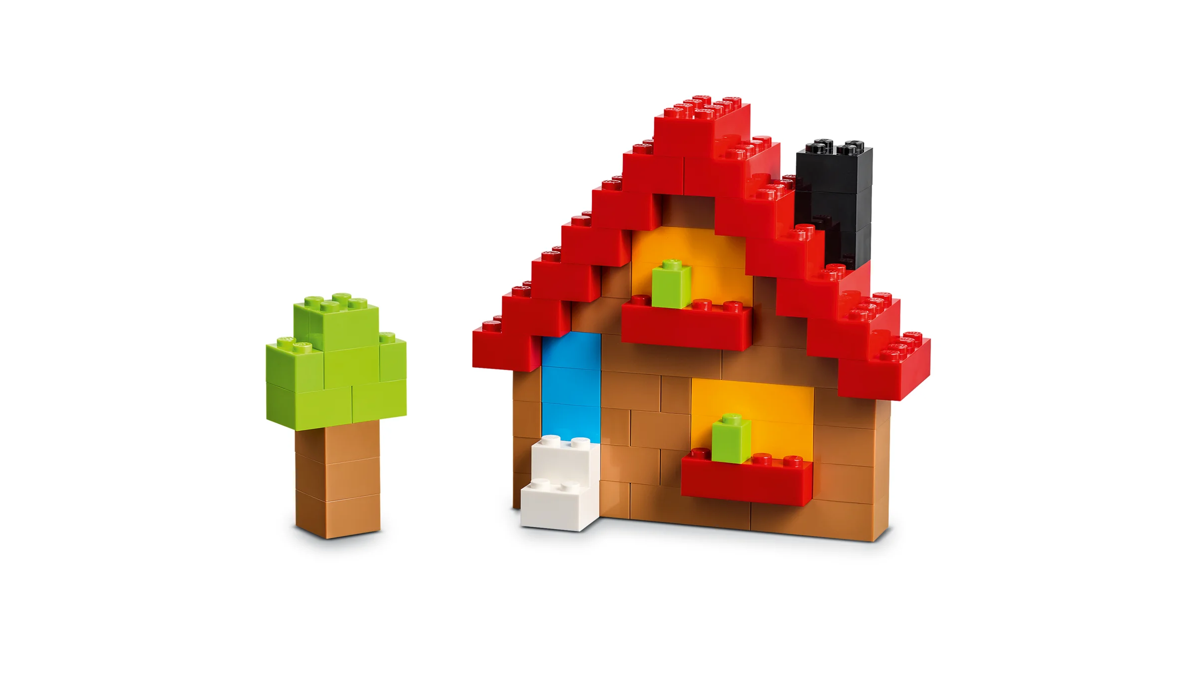Construcție simplă din cărămizi LEGO: o căsuță cu acoperiș roșu și un copac verde.