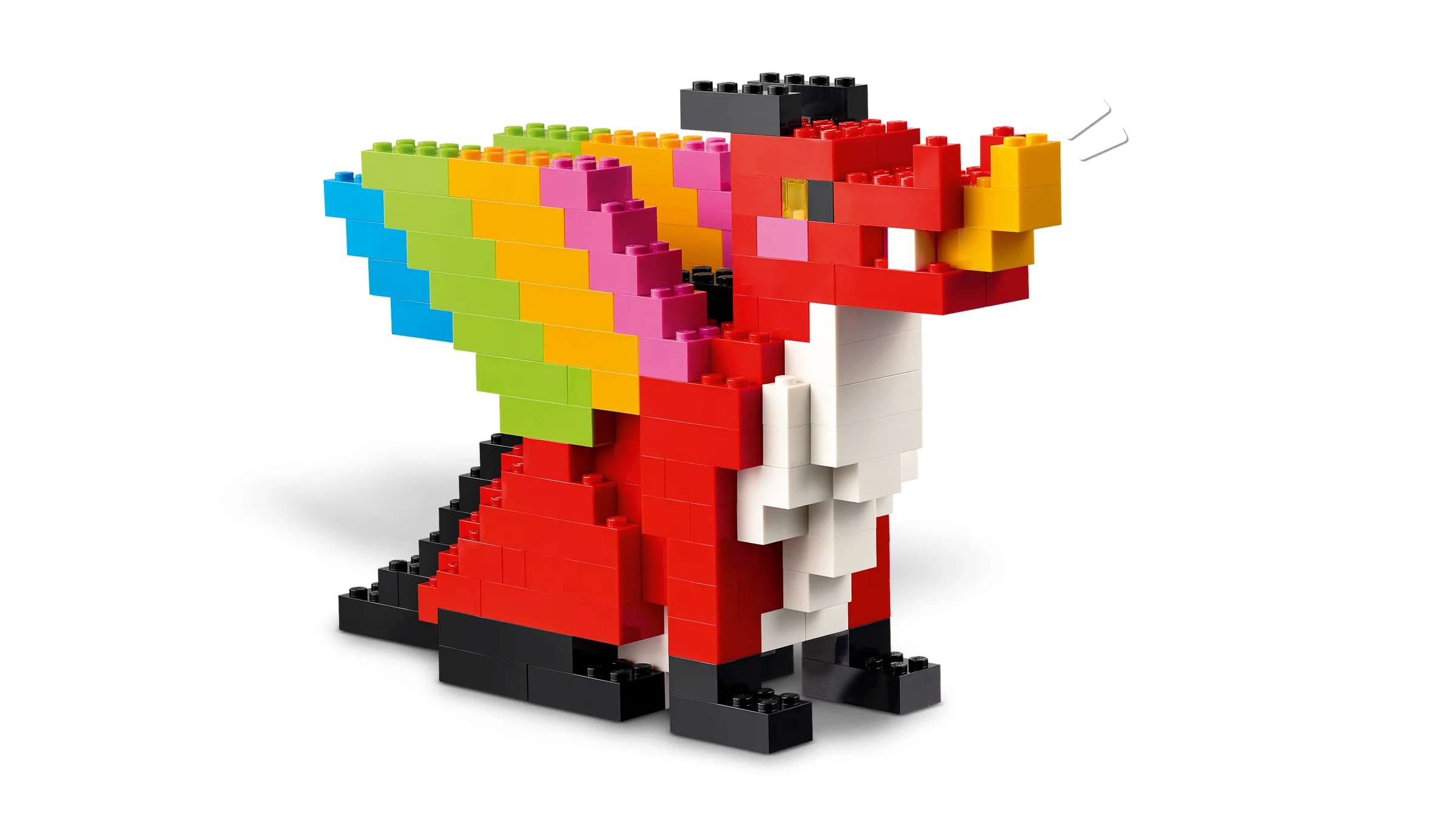 Dragon colorat construit din cărămizi LEGO, cu aripi curcubeu și corp roșu.